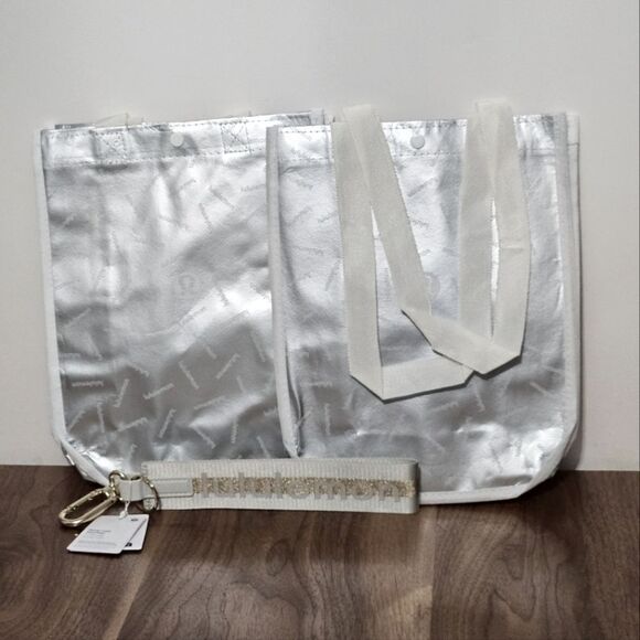 Lululemon, Set of 2 Small silver Shopping Bags & 1 Vapor & Gold Keychain. NWT - Picture 1 of 4